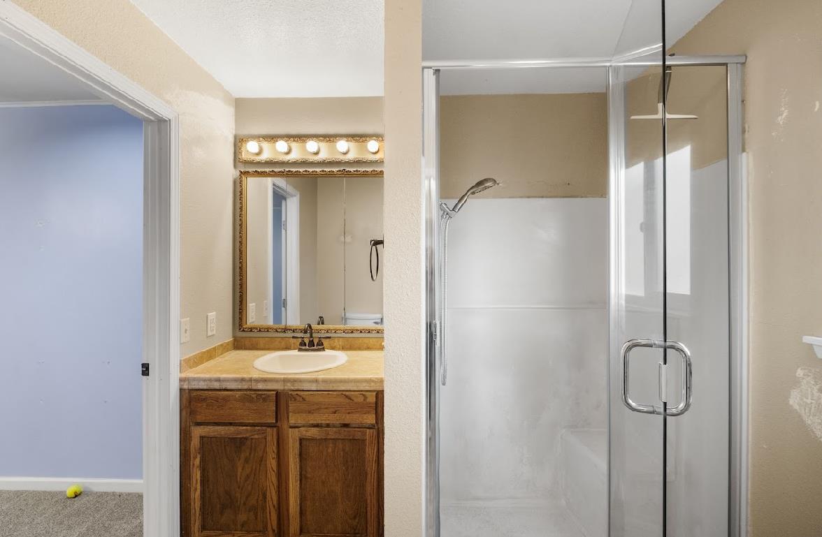 3402 Burson Road Burson, CA 95225 - Photo 36 of 65 a bathroom with a shower and a sink