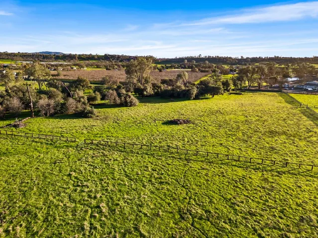 a view of a golf course with a lake view