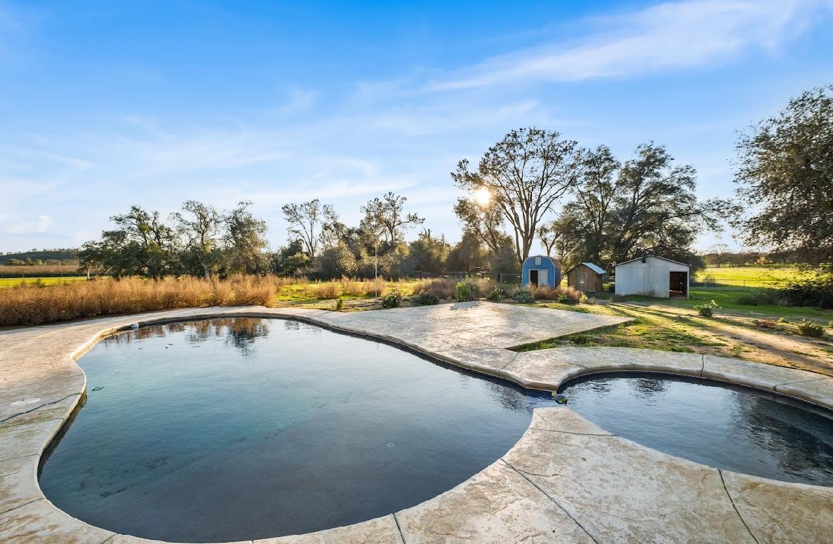 3402 Burson Road Burson, CA 95225 - Photo 9 of 65 a view of a swimming pool with a chairs