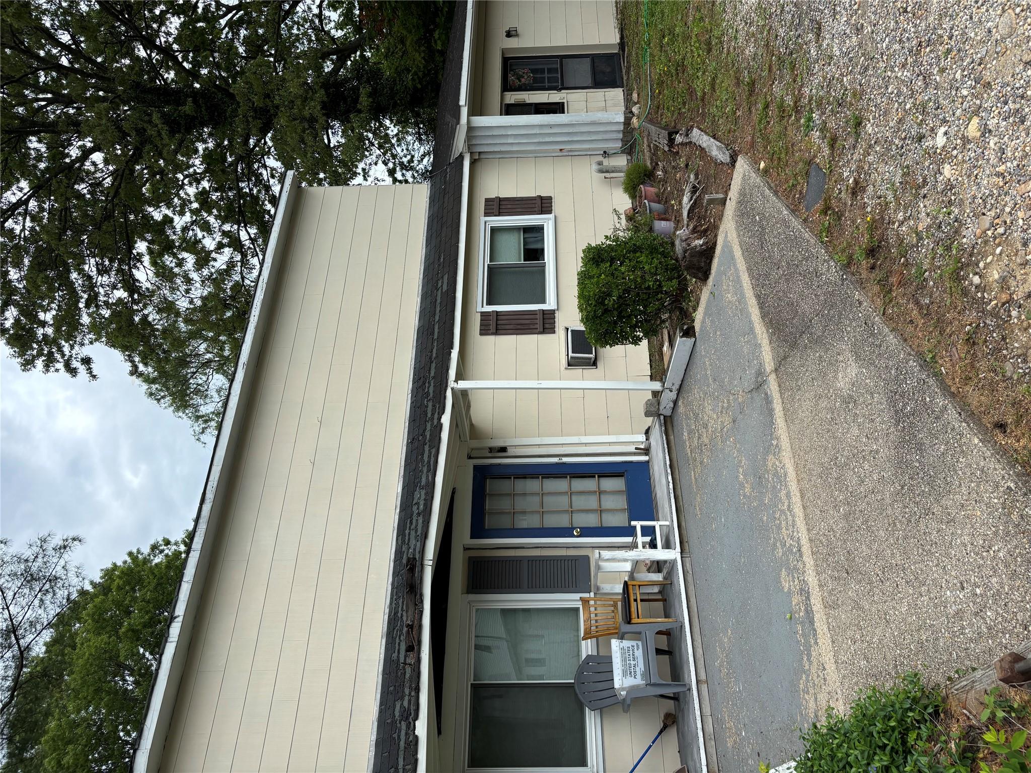 a front view of a house with outdoor space