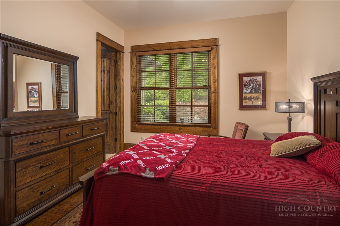 115 Passionflower Trail Boone, NC 28607 - Photo 30 of 50 a bedroom with a bed and a window
