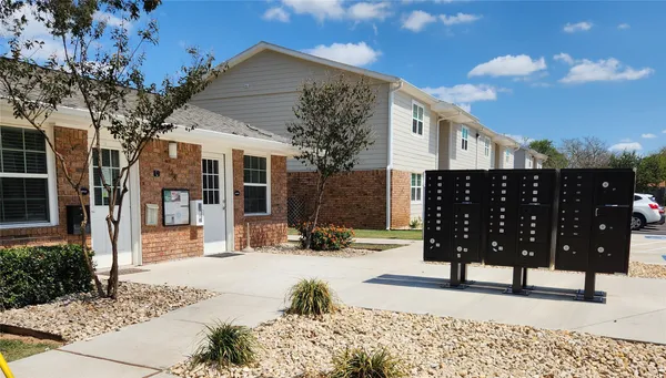 an empty room with wooden floor and closet