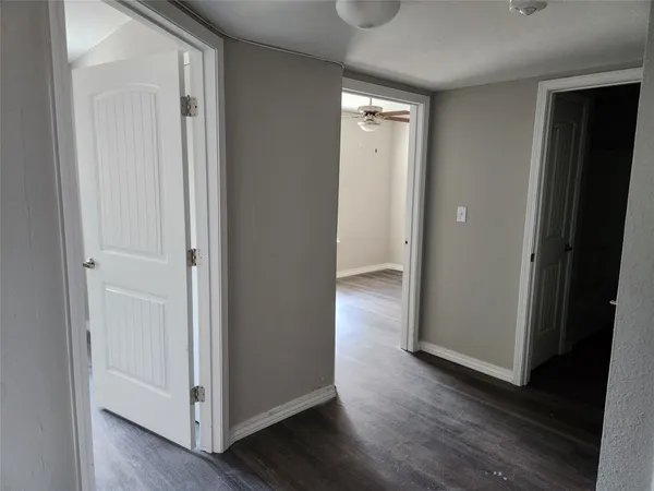 a kitchen with a refrigerator and a sink