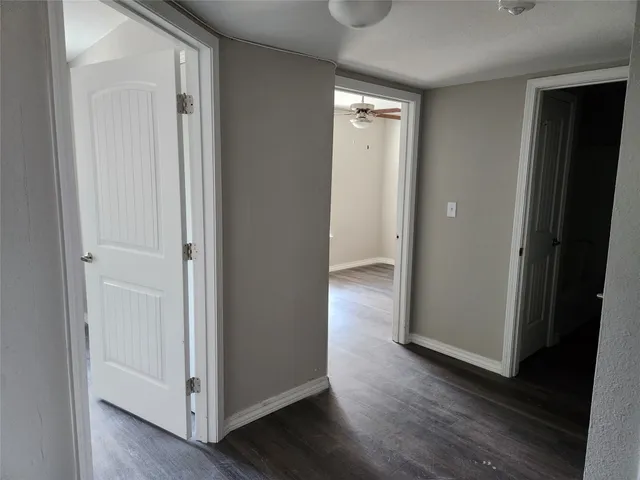 a kitchen with a refrigerator and a sink