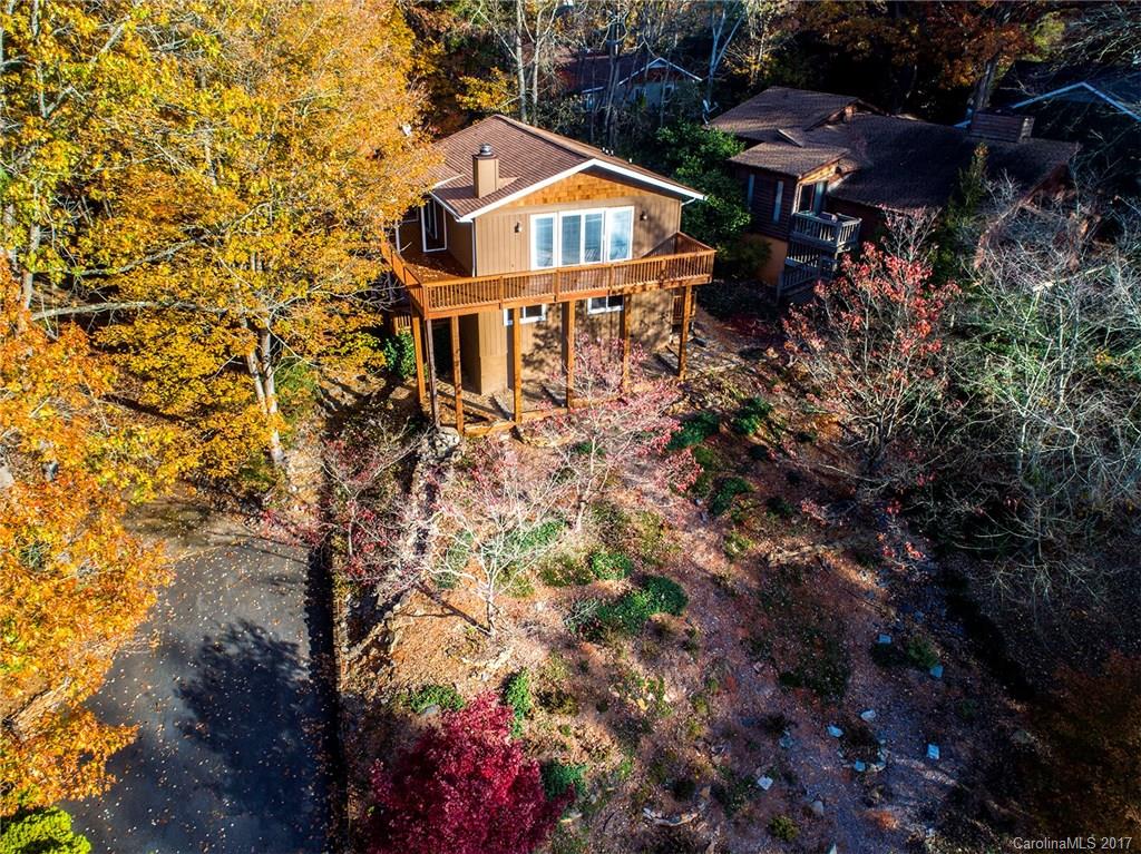 9009 Cebu Court, Unit 9 Tega Cay, SC 29708 - Photo 2 of 24 a house with trees in front of it