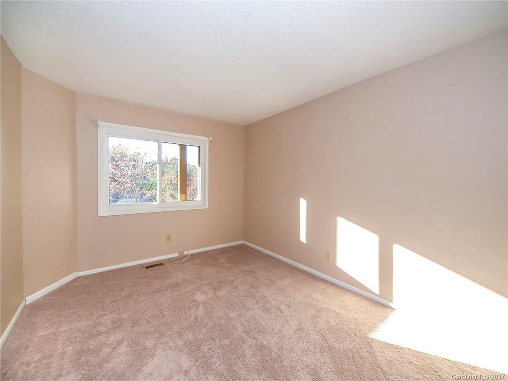 9009 Cebu Court, Unit 9 Tega Cay, SC 29708 - Photo 13 of 24 an empty room with windows