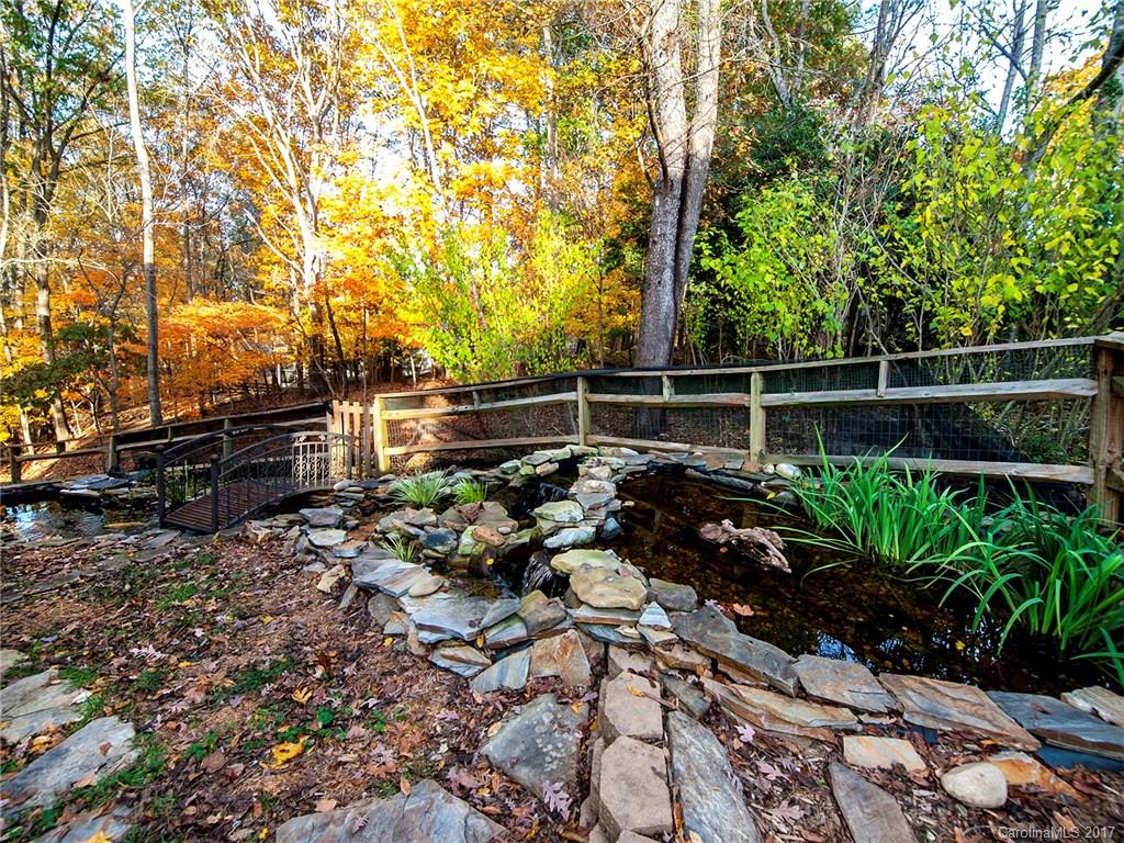 9009 Cebu Court, Unit 9 Tega Cay, SC 29708 - Photo 16 of 24 a backyard of a house with lots of green space