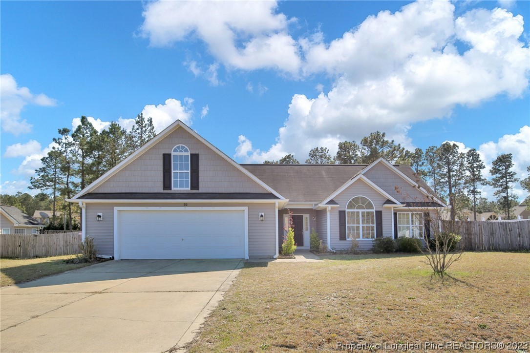 92 Holly Oak Circle Bunnlevel, NC 28323 - Photo 1 of 23 a front view of a house with a yard