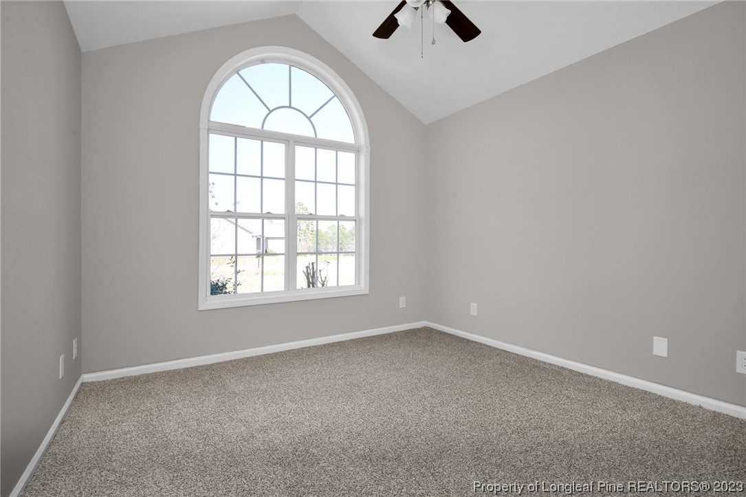 92 Holly Oak Circle Bunnlevel, NC 28323 - Photo 15 of 23 an empty room with windows and fan