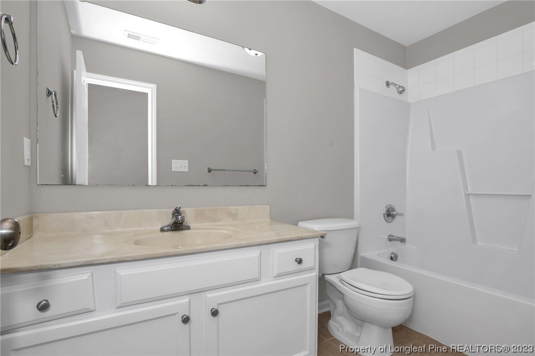 92 Holly Oak Circle Bunnlevel, NC 28323 - Photo 17 of 23 a bathroom with a sink toilet vanity and shower