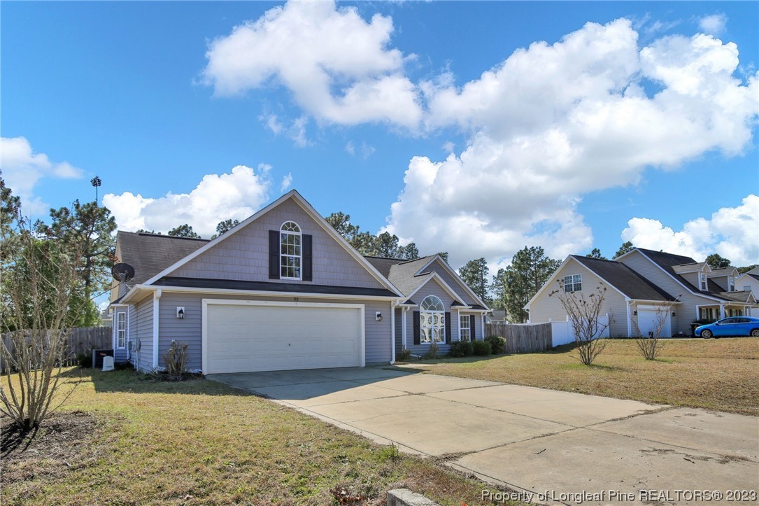 92 Holly Oak Circle Bunnlevel, NC 28323 - Photo 2 of 23 a house view with a garden