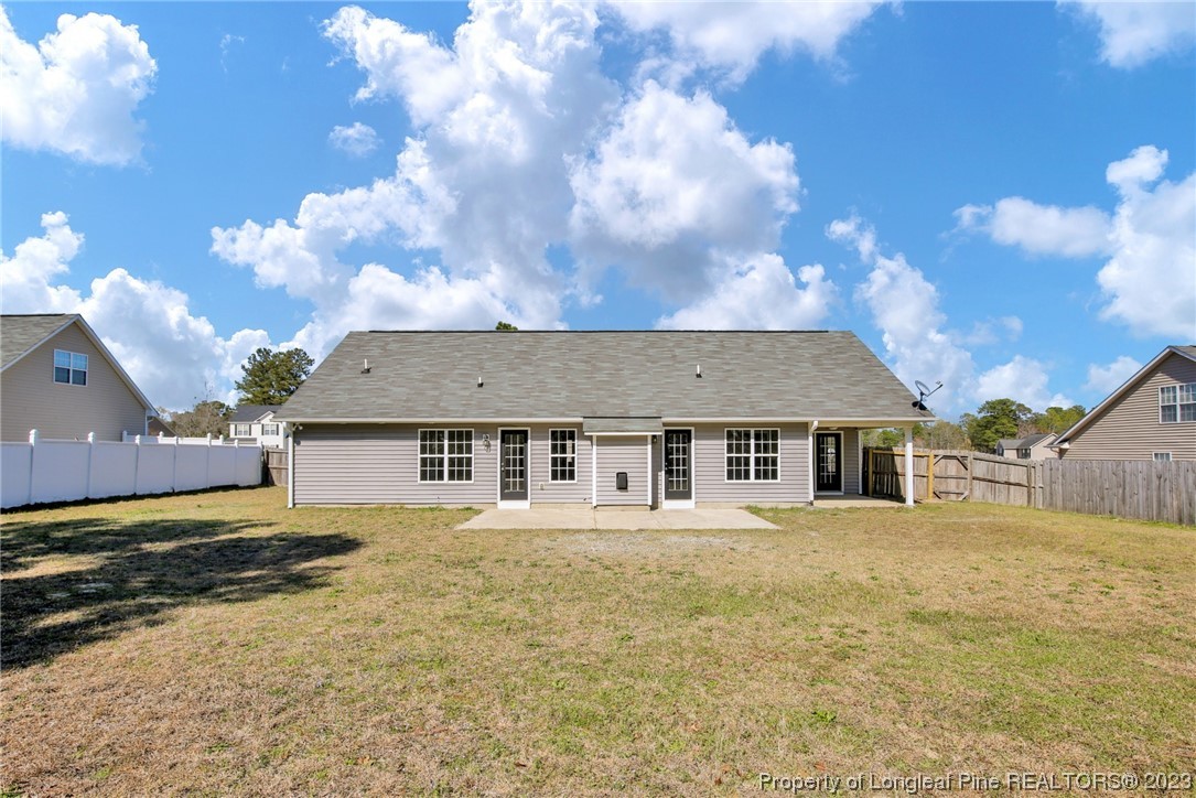 92 Holly Oak Circle Bunnlevel, NC 28323 - Photo 21 of 23 front view of a house with a yard