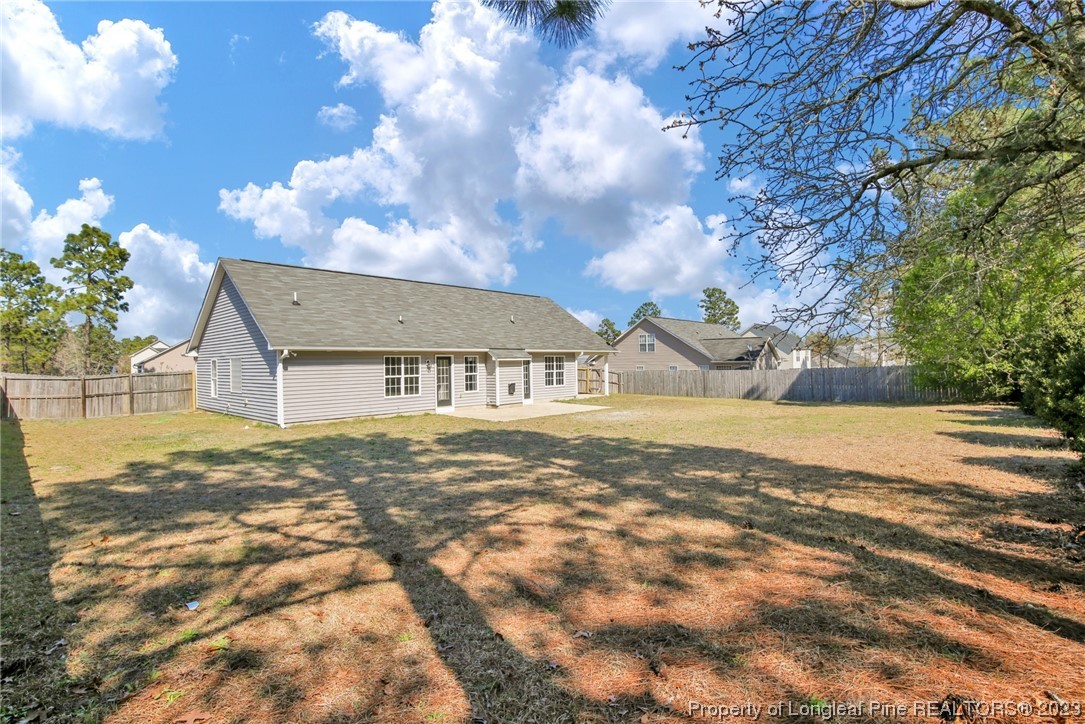 92 Holly Oak Circle Bunnlevel, NC 28323 - Photo 22 of 23 a view of a house with a yard