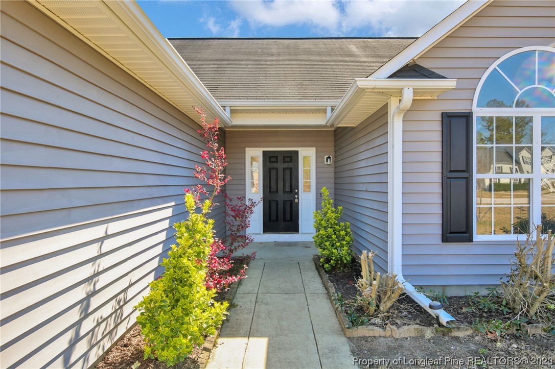 92 Holly Oak Circle Bunnlevel, NC 28323 - Photo 3 of 23 a front view of a house with garden