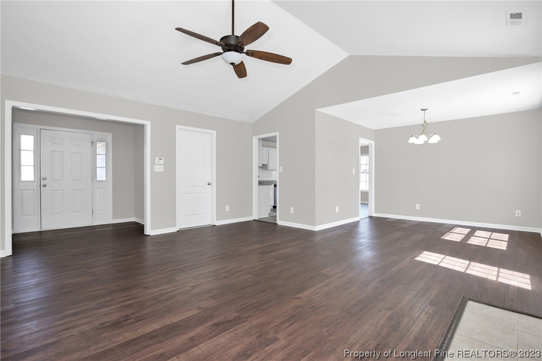 92 Holly Oak Circle Bunnlevel, NC 28323 - Photo 5 of 23 a view of an empty room with wooden floor and a ceiling fan