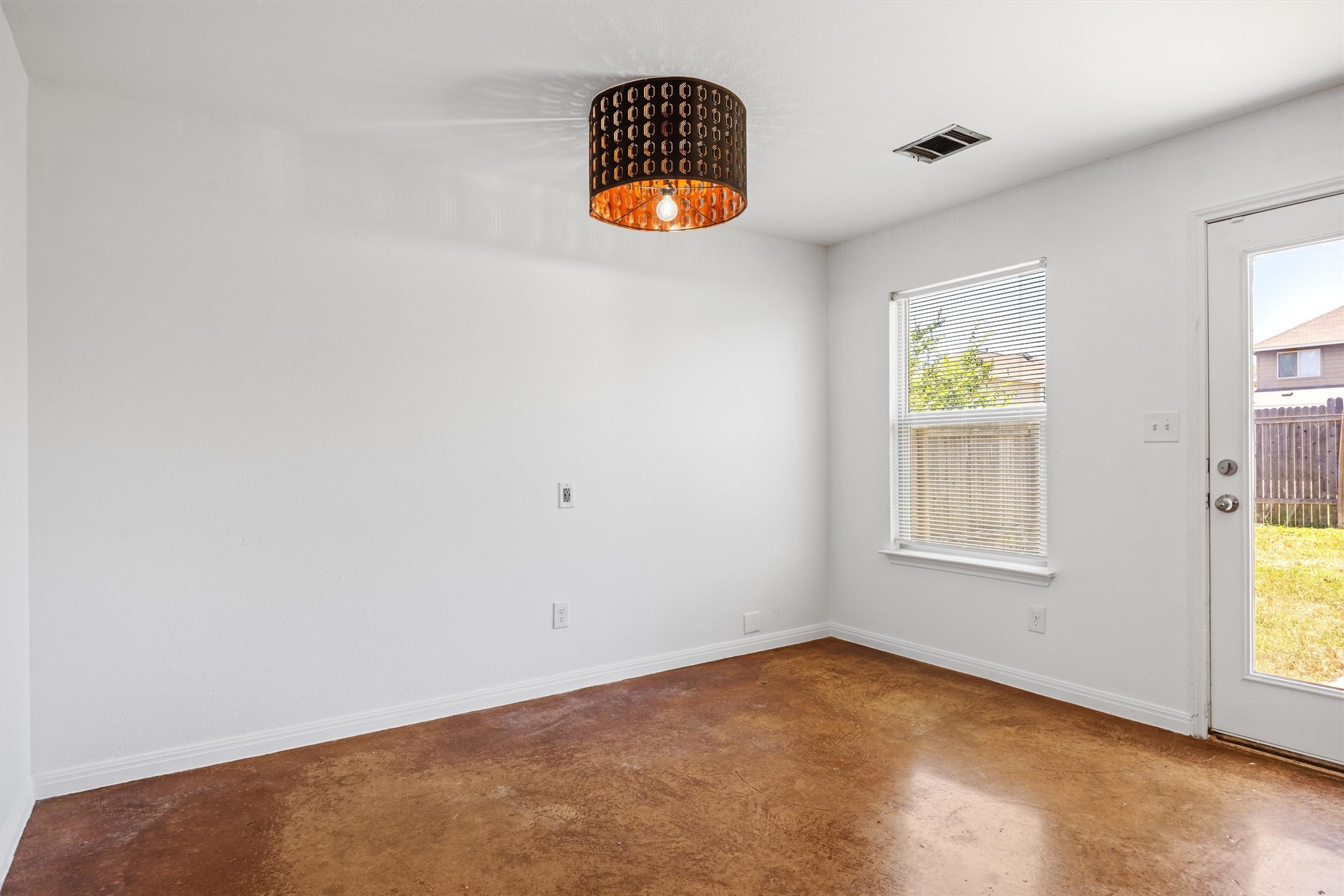 4516 Kind Way, Unit 253 Austin, TX 78725 - Photo 10 of 31 an empty room with a window