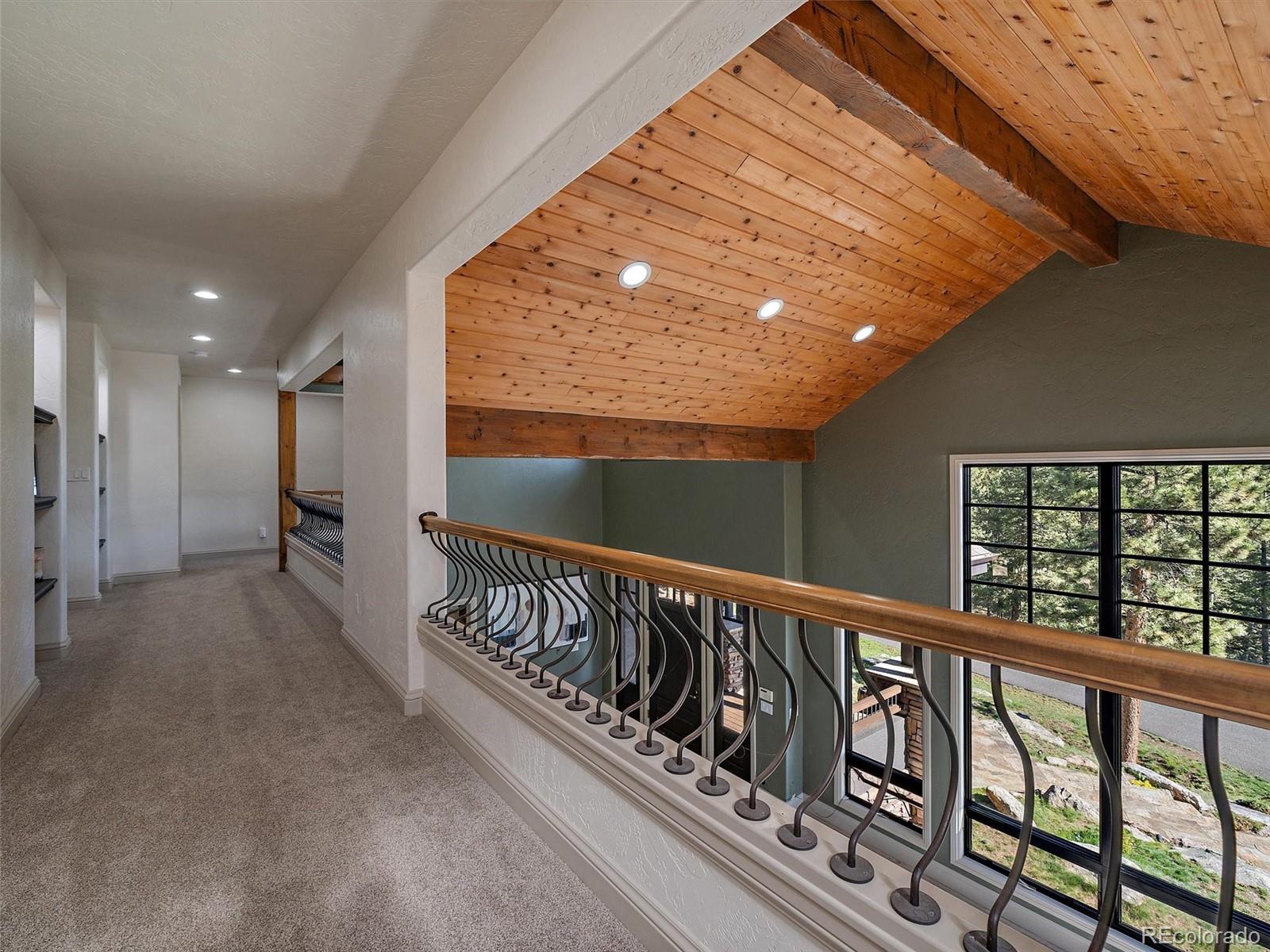 33442 Meadow Mountain Road Evergreen, CO 80439 - Photo 23 of 40 a view of balcony with wooden floor