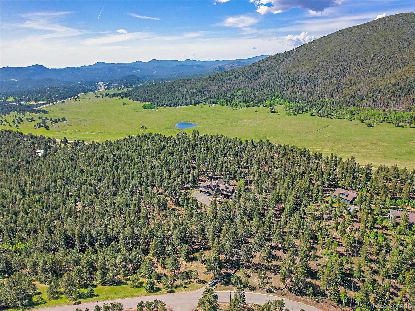 33442 Meadow Mountain Road Evergreen, CO 80439 - Photo 39 of 40 a view of a city with an ocean view
