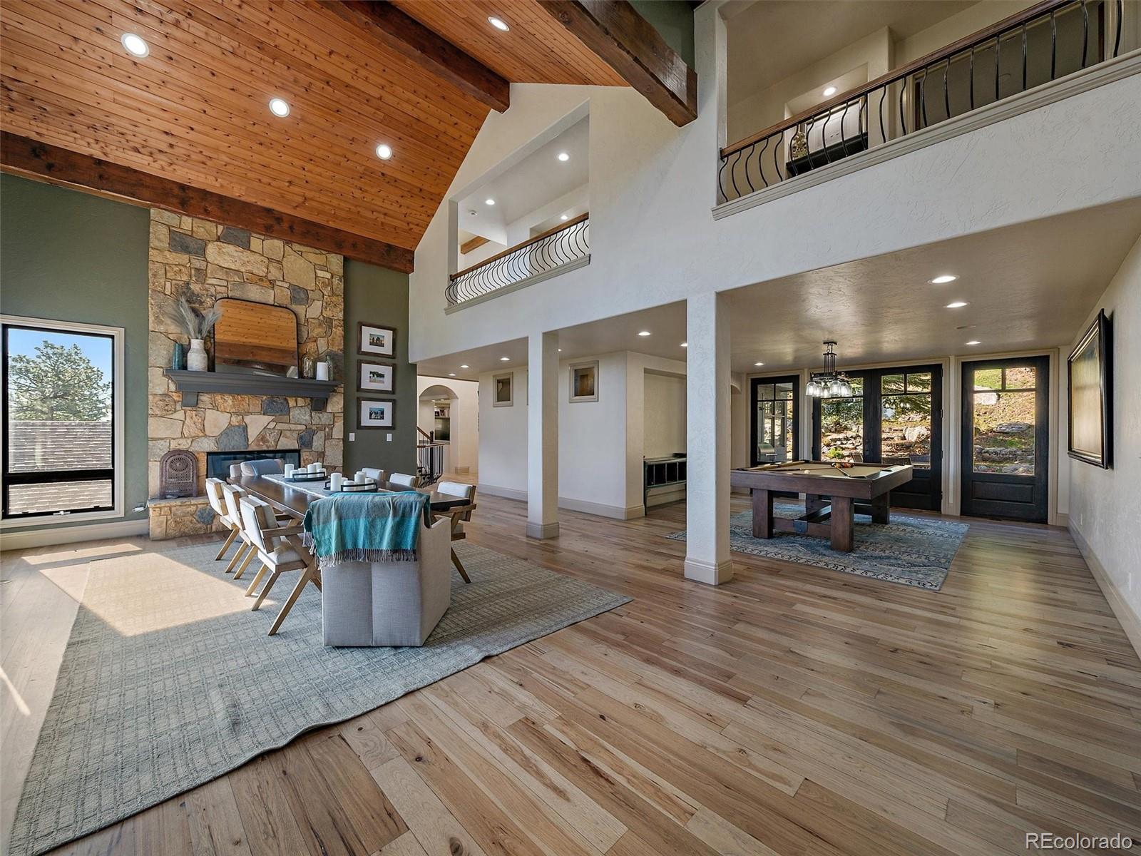 33442 Meadow Mountain Road Evergreen, CO 80439 - Photo 4 of 40 a view of a dining room with furniture window and wooden floor