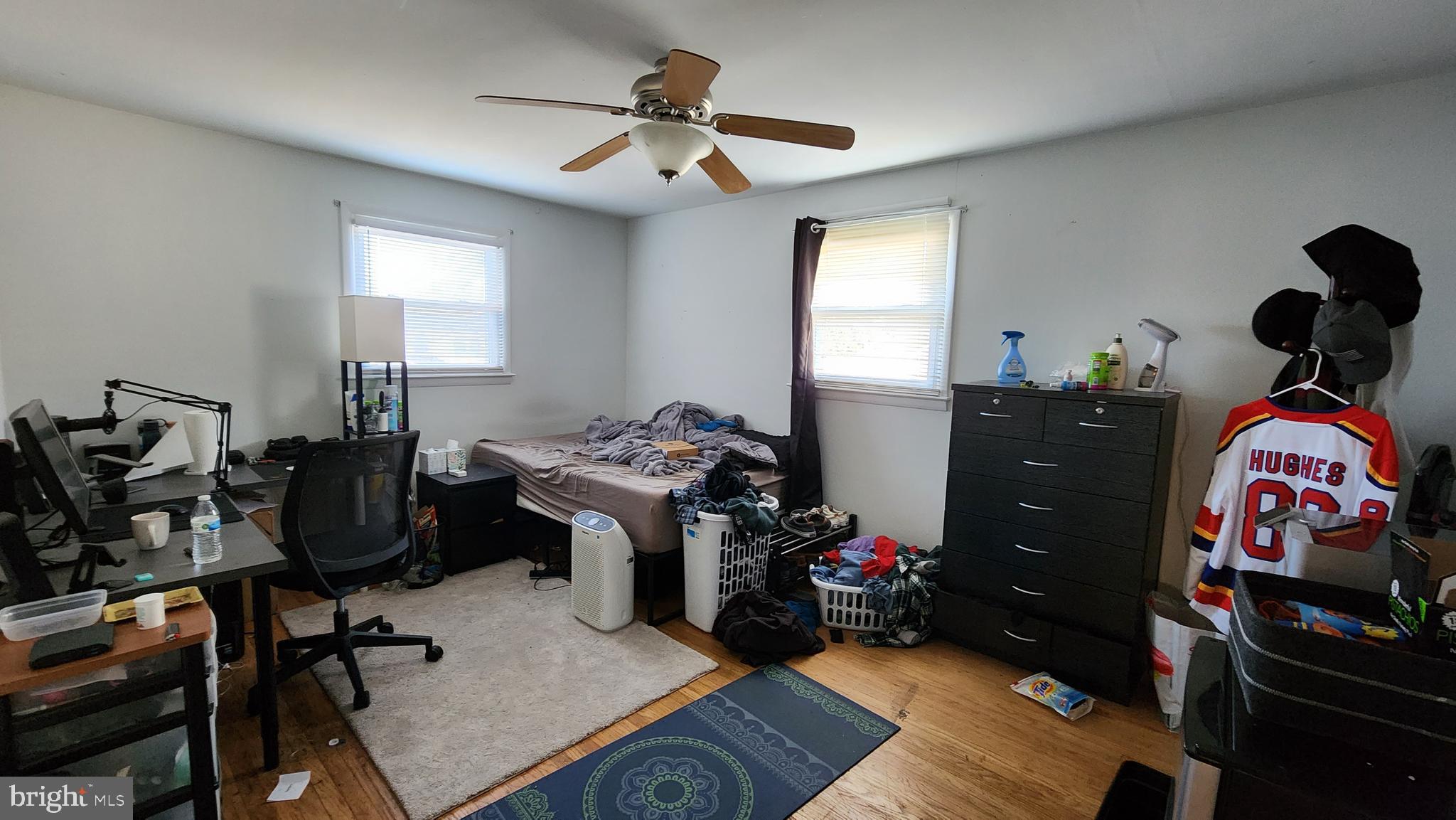 611 Whitman Street Glassboro, NJ 08028 - Photo 5 of 11 a bedroom with furniture and wooden floor