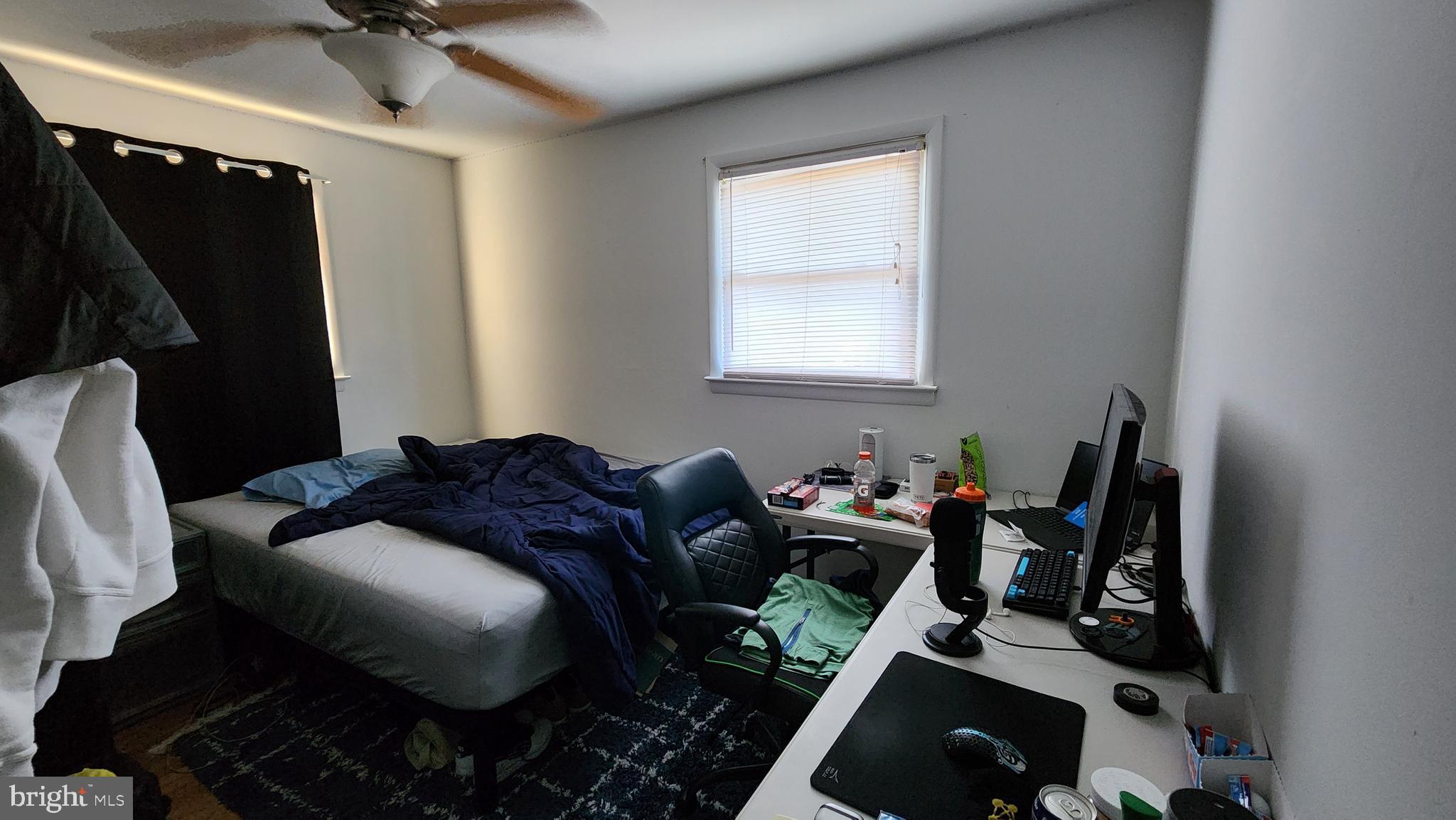 611 Whitman Street Glassboro, NJ 08028 - Photo 7 of 11 a bed room with a bed and a window