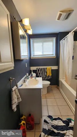a bathroom with a bathtub and a sink