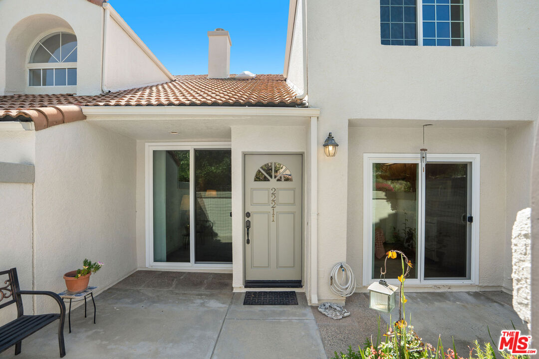 22211 Frontier Place Chatsworth, CA 91311 - Photo 20 of 26 a front view of a house with shower
