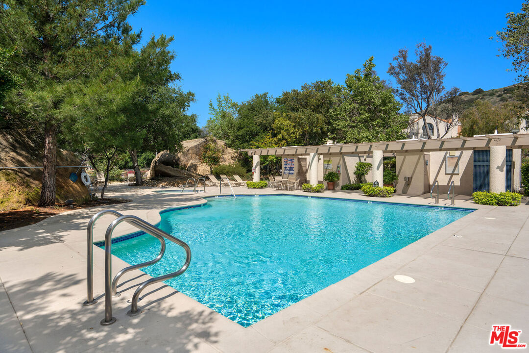 22211 Frontier Place Chatsworth, CA 91311 - Photo 21 of 26 a view of swimming pool with a patio