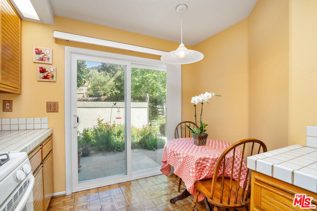 22211 Frontier Place Chatsworth, CA 91311 - Photo 6 of 26 a bedroom with a bed and a chandelier