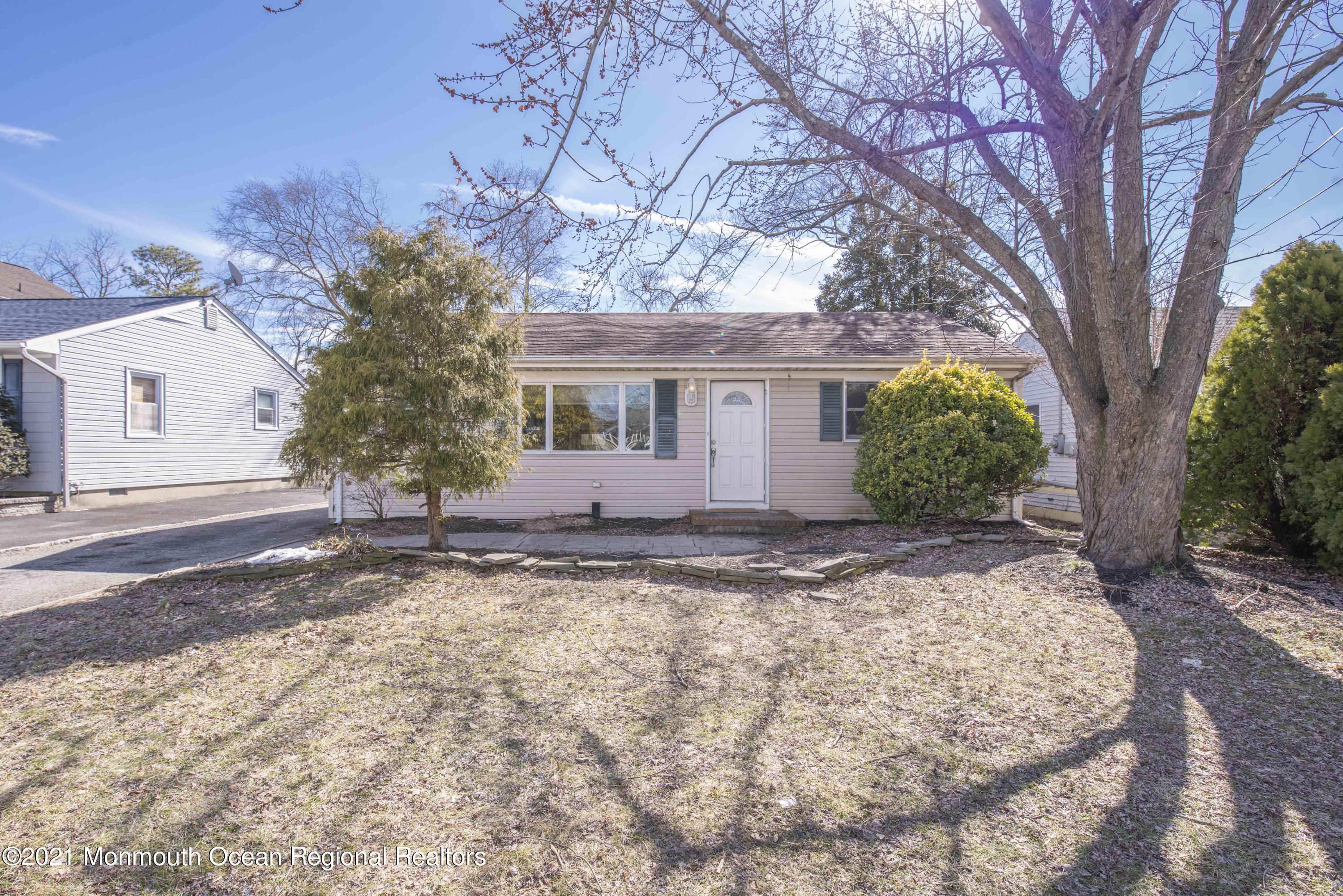 3208 Kickapoo Avenue Point Pleasant, NJ 08742 - Photo 1 of 23 a view of a house with a yard covered in snow