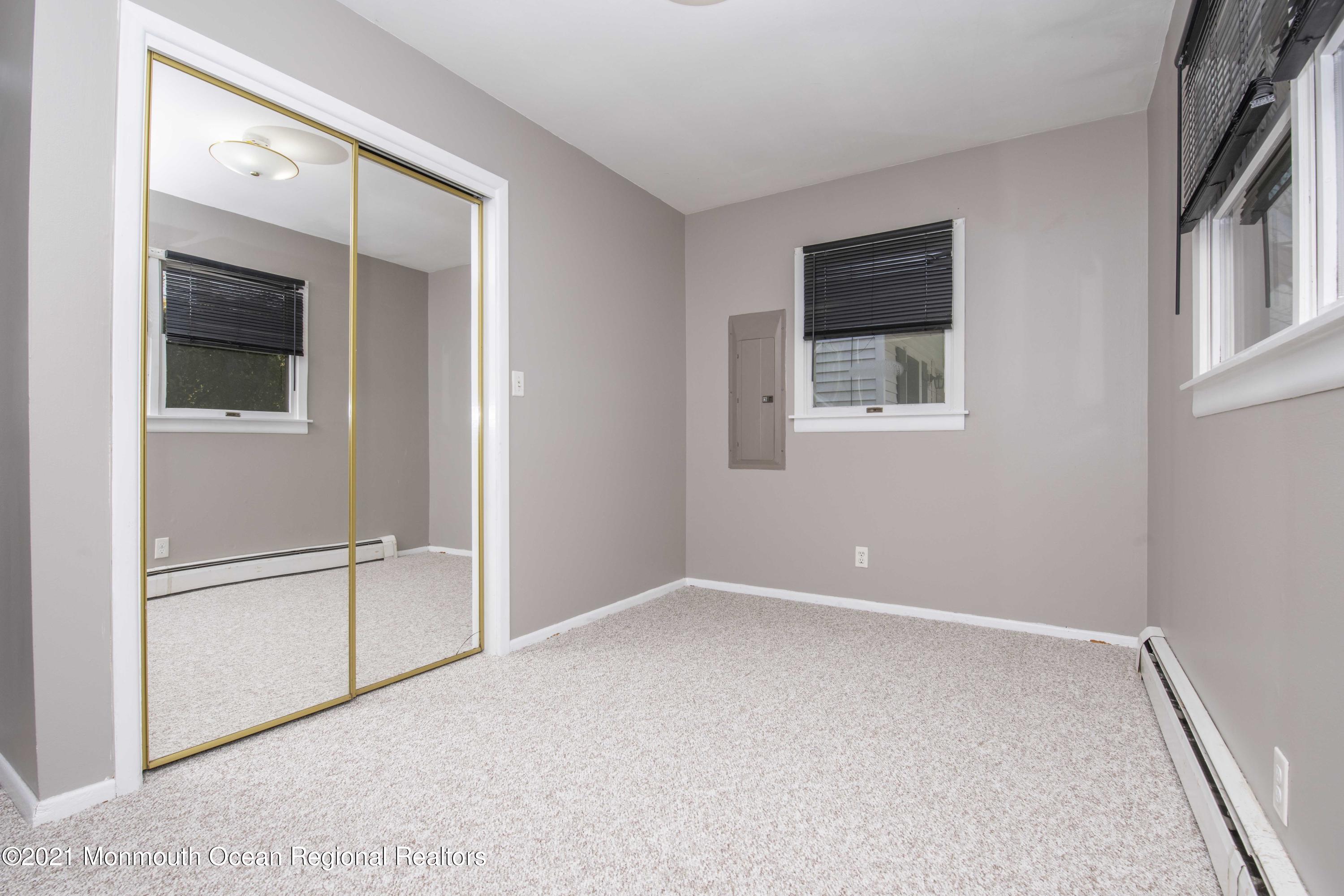 3208 Kickapoo Avenue Point Pleasant, NJ 08742 - Photo 14 of 23 an empty room with windows