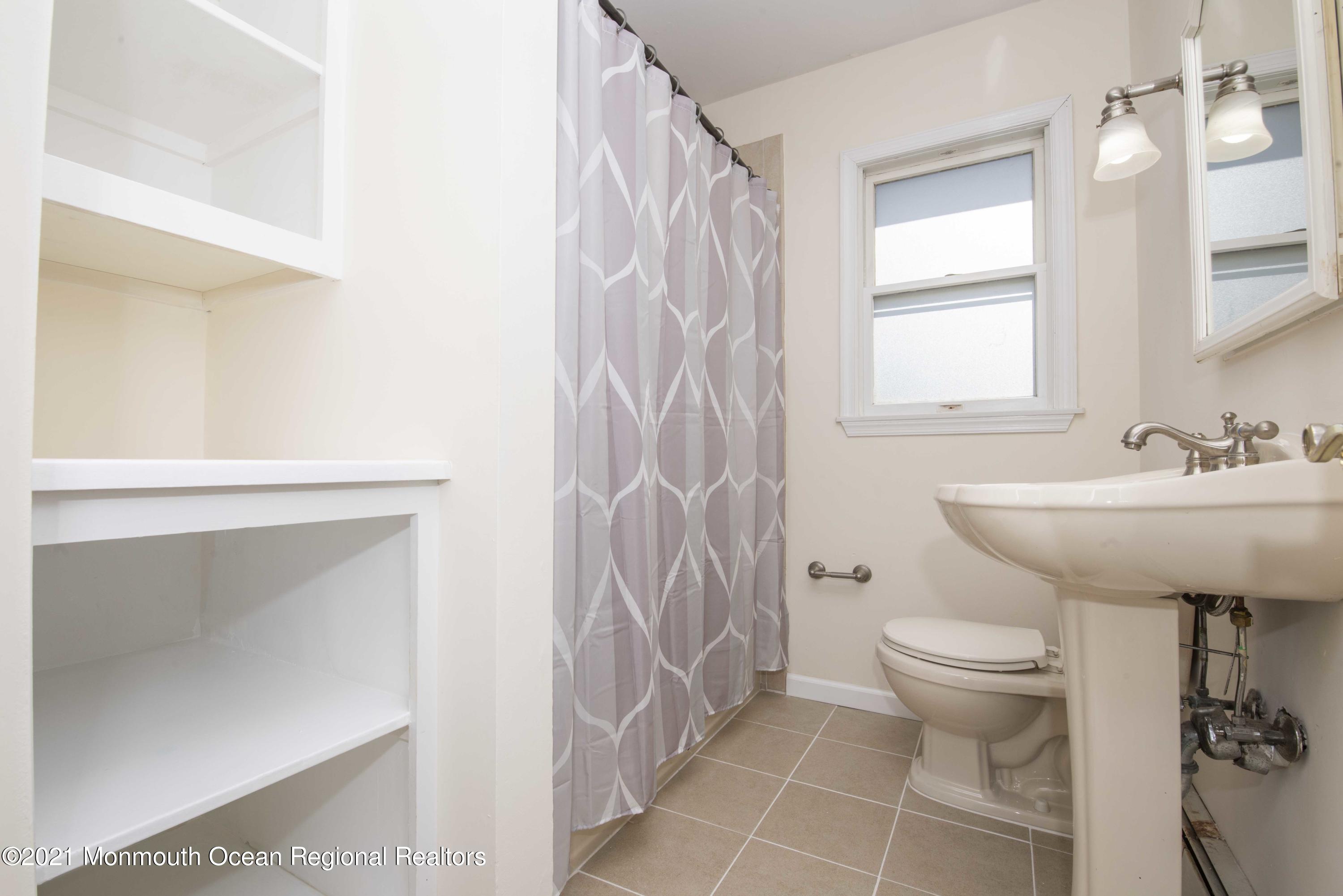 3208 Kickapoo Avenue Point Pleasant, NJ 08742 - Photo 17 of 23 a bathroom with a sink toilet and shower