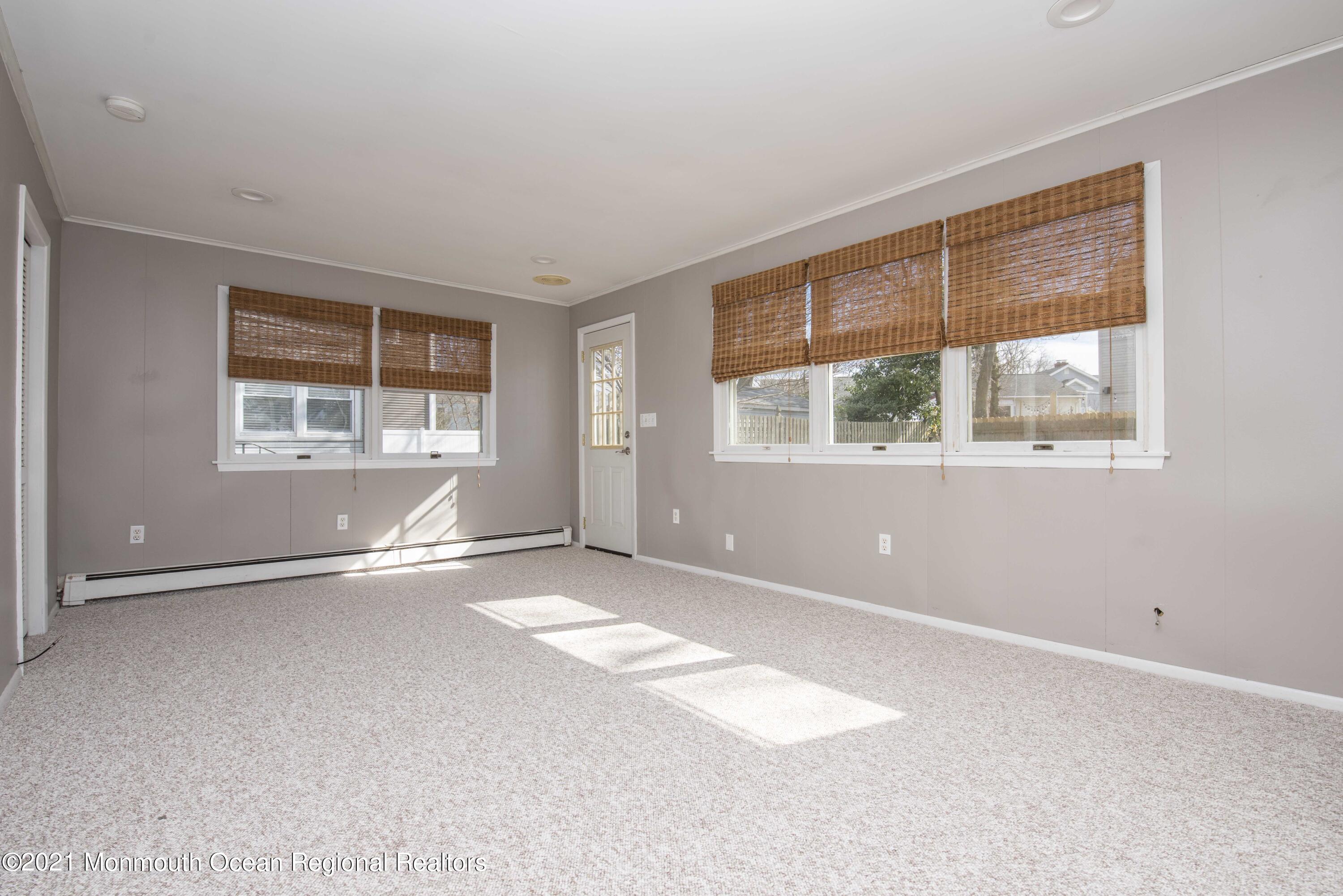 3208 Kickapoo Avenue Point Pleasant, NJ 08742 - Photo 18 of 23 an empty room with windows