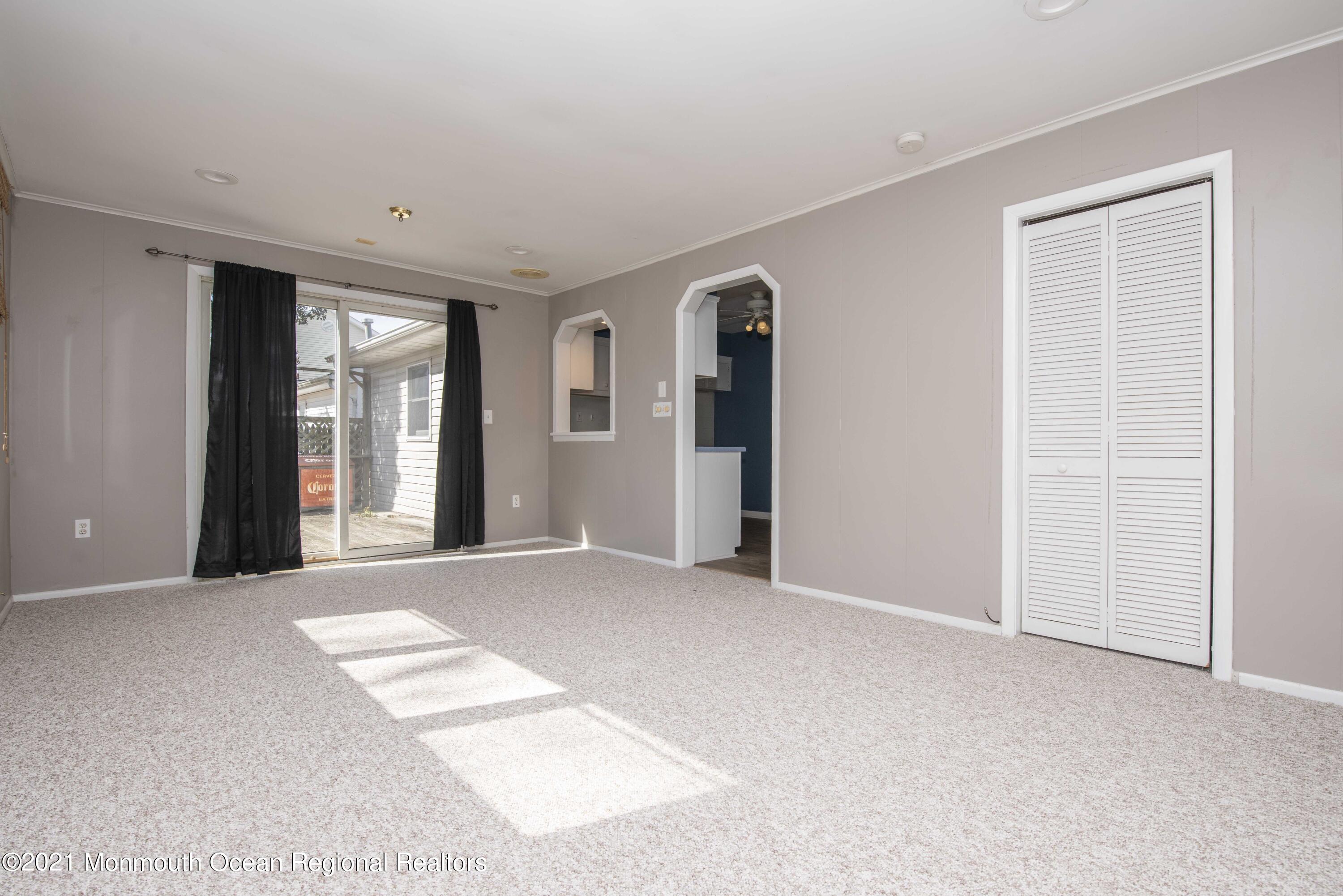 3208 Kickapoo Avenue Point Pleasant, NJ 08742 - Photo 20 of 23 a view of an empty room with window and wooden floor