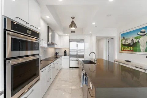 a bathroom with a sink a mirror and a bathtub