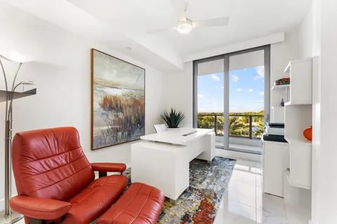 a view of a floor to ceiling window with an outdoor seating