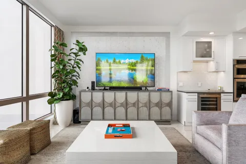 a living room with furniture and a large window