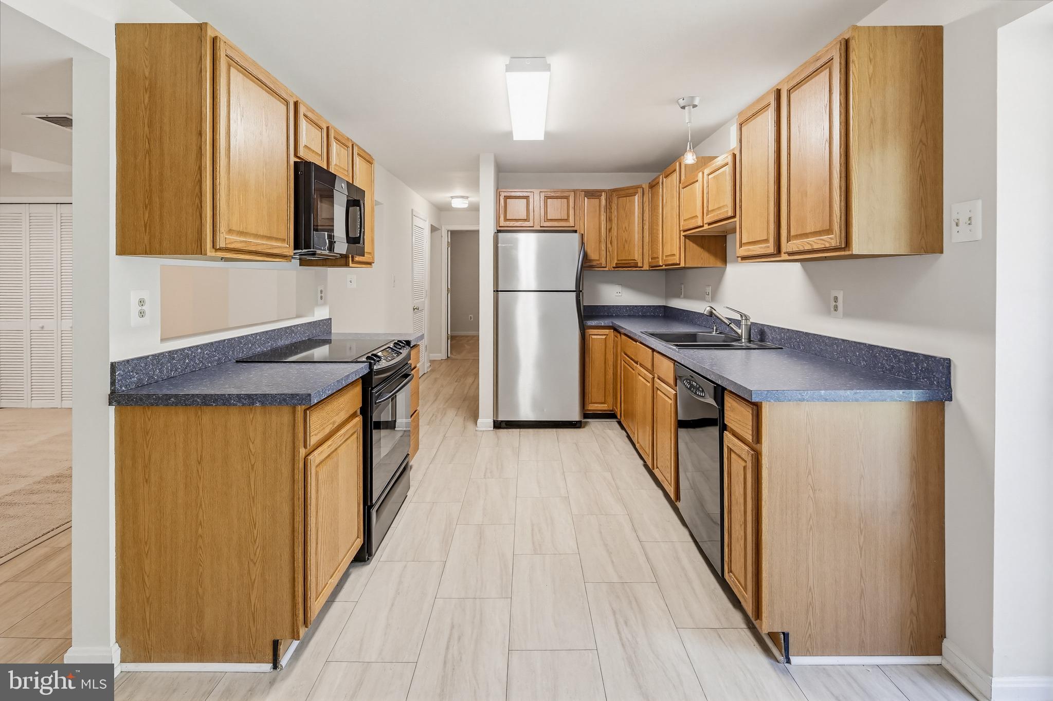 8266 Spring Branch Court Laurel, MD 20723 - Photo 50 of 73 Luxury vinyl plank flooring in kitchen