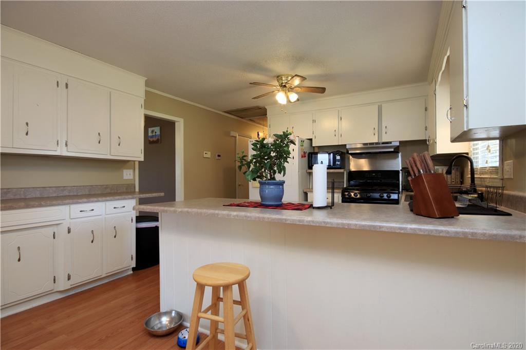 206 Partridge Road, Unit 9 & 11 Union, SC 29379 - Photo 11 of 21 a kitchen with stainless steel appliances granite countertop a stove and a refrigerator