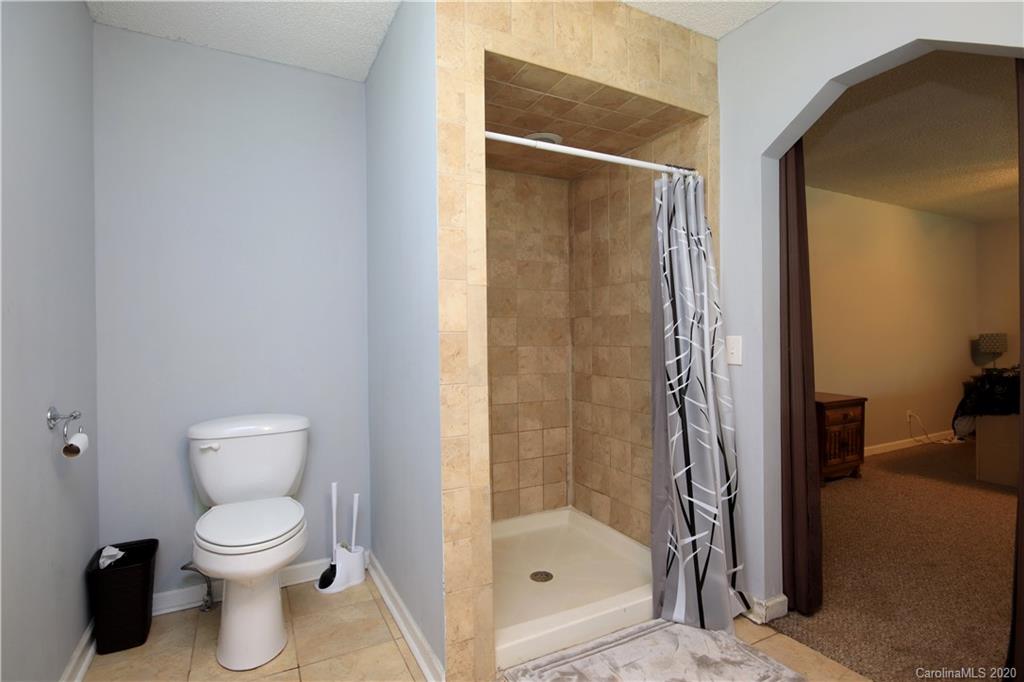 206 Partridge Road, Unit 9 & 11 Union, SC 29379 - Photo 13 of 21 a bathroom with a toilet and a shower