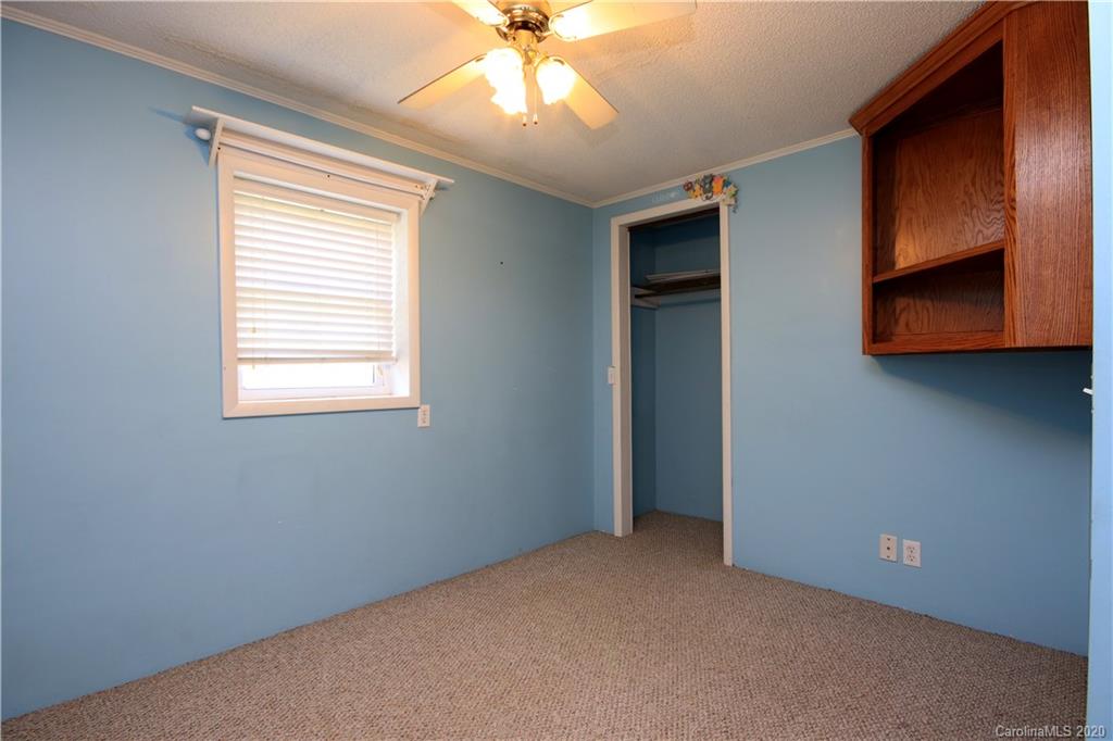206 Partridge Road, Unit 9 & 11 Union, SC 29379 - Photo 16 of 21 a view of an empty room with window and chandelier fan