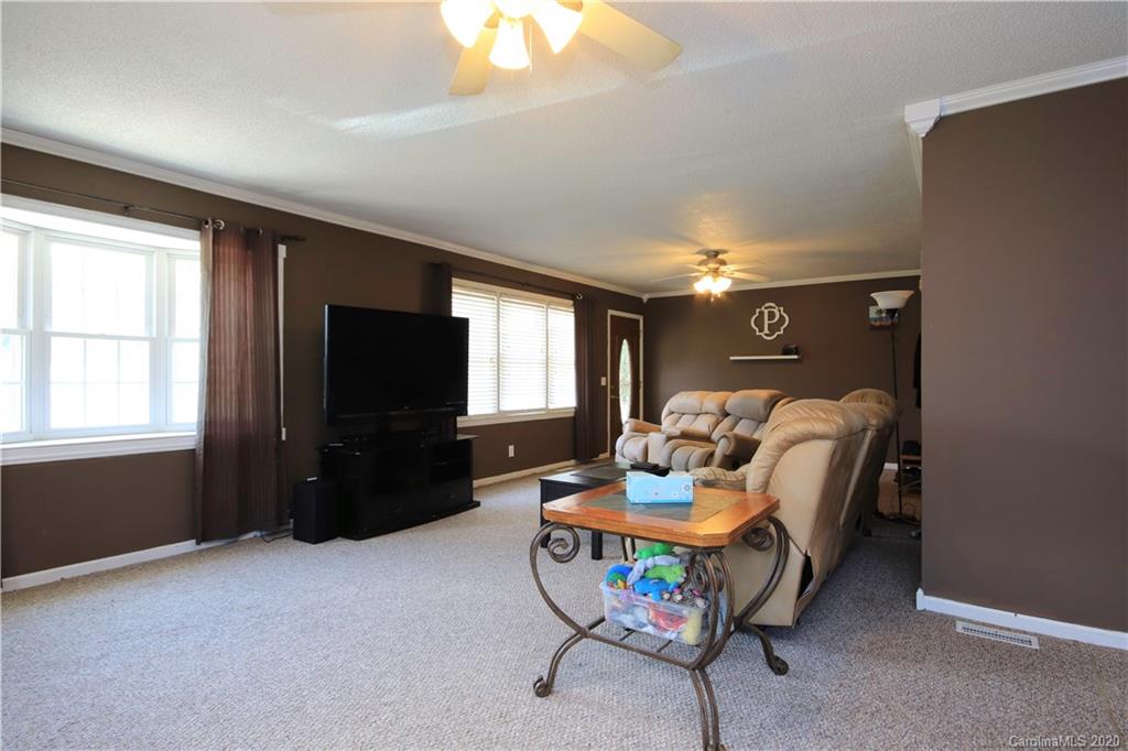 206 Partridge Road, Unit 9 & 11 Union, SC 29379 - Photo 7 of 21 a living room with furniture a flat screen tv and a window