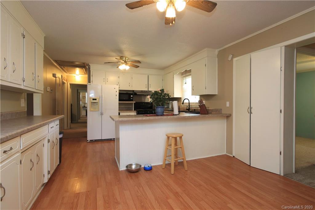 206 Partridge Road, Unit 9 & 11 Union, SC 29379 - Photo 9 of 21 a kitchen with kitchen island a counter top space a sink stainless steel appliances and cabinets