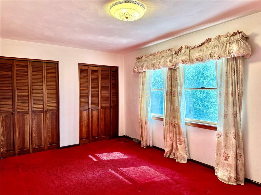 1142 Apples Mill Road West Newton, PA 15089 - Photo 16 of 27 a view of empty room with floor to ceiling window and ceiling fan