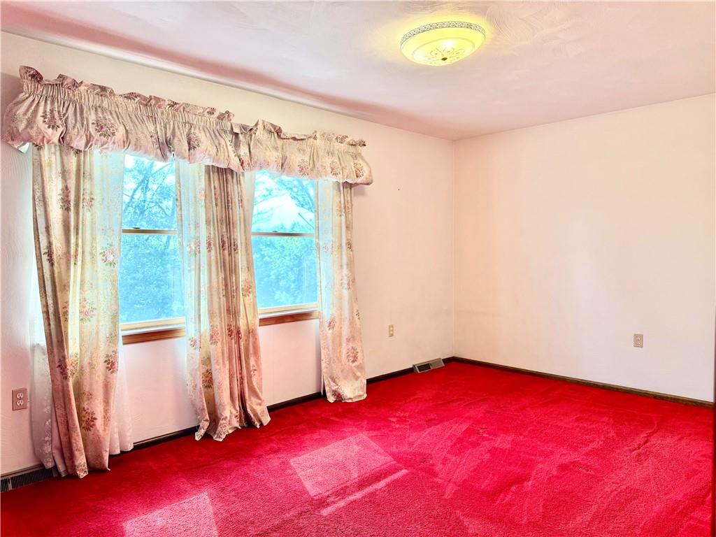 1142 Apples Mill Road West Newton, PA 15089 - Photo 17 of 27 a view of empty room with wooden floor and fan