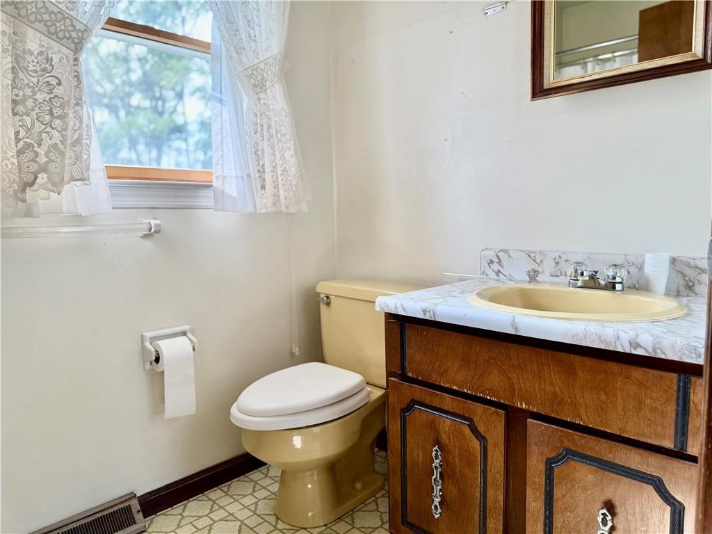 1142 Apples Mill Road West Newton, PA 15089 - Photo 22 of 27 a bathroom with a sink a mirror and a toilet