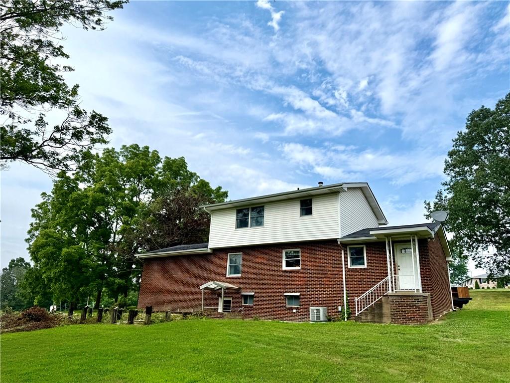 1142 Apples Mill Road West Newton, PA 15089 - Photo 26 of 27 a front view of house with yard and green space