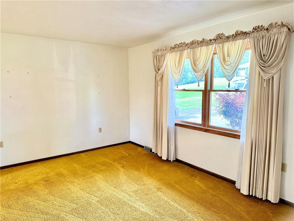 1142 Apples Mill Road West Newton, PA 15089 - Photo 7 of 27 a view of an empty room with a window