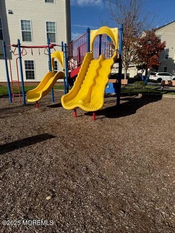 a view of a park with iron fence