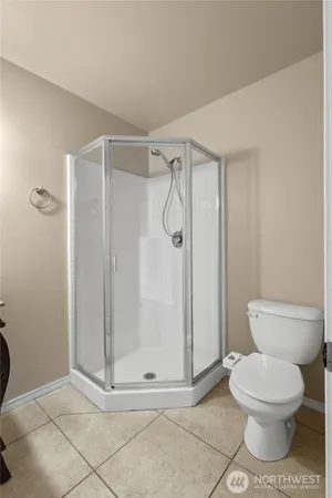 a bathroom with a shower and a toilet